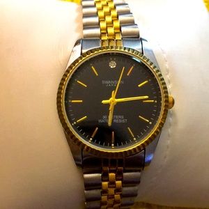 Ladies casual silver and gold tone plated  watch with round black and gold face